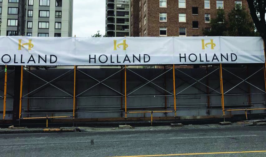 HOLLAND scaffolding banner mounted on urban construction scaffolding