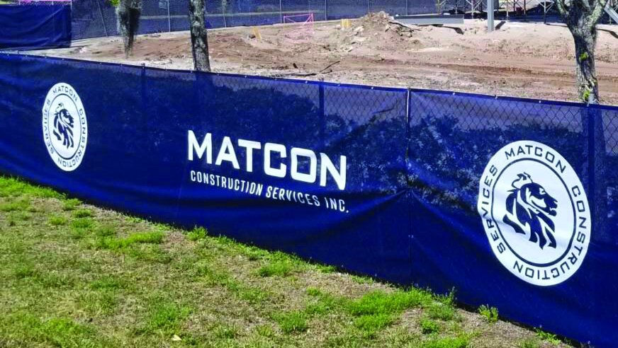 MATCON Construction Services custom fence wrap on chain-link jobsite fence